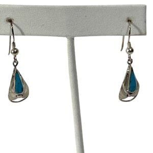 Turquoise and alpaca silver dangle earrings.